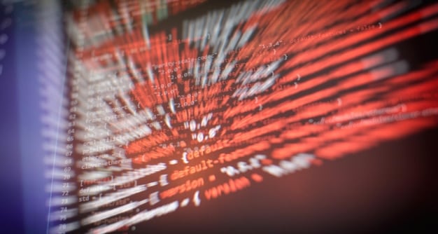 A detailed close-up of lines of code being analyzed on a computer screen, emphasizing the meticulous nature of a crypto security audit. Binary code streams in the background represent the complexity of the task.