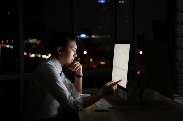 A person sitting at a desk looking at multiple screens all displaying lines of smart contract code. Several coffee cups litter the desk showing the long night of work.